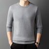 Knitted sweater with semi-high collar and round neckline in yarn