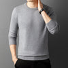 Knitted sweater with semi-high collar and round neckline in yarn